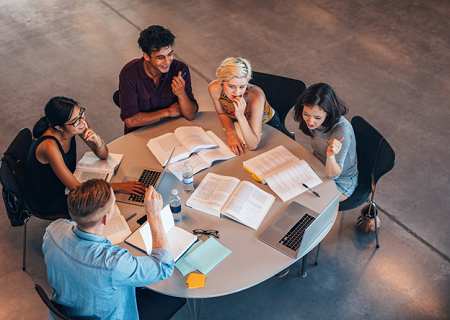 Students studying around a table