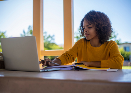 Student studying at a computer