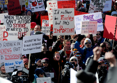 teachers attending a protest to fight for higher salaries